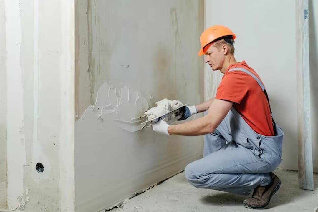 man is doing plaster works