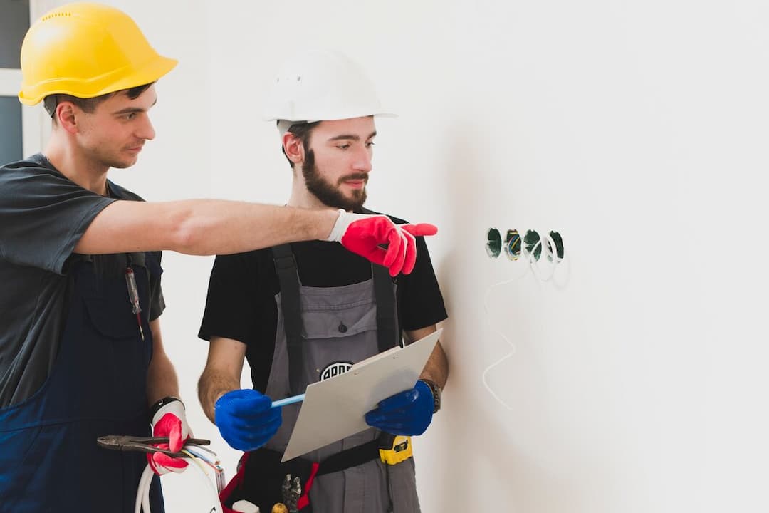 workers are doing home electrical work